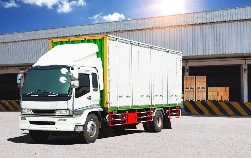container-trucks-loads-bulk-package-boxes-distribution-warehouse-dock-logistics-transport_36860-2429